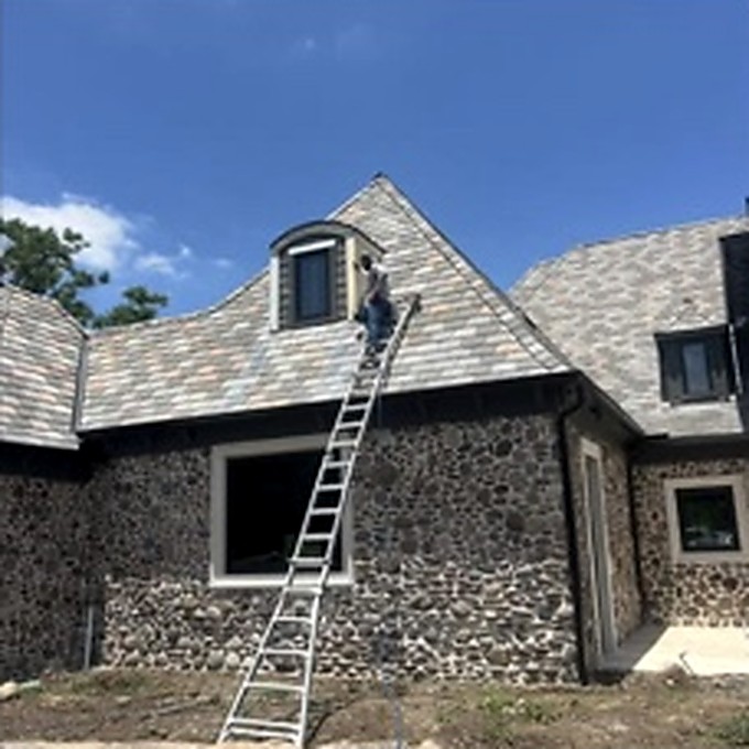 Roof and dormer exterior work with a ladder